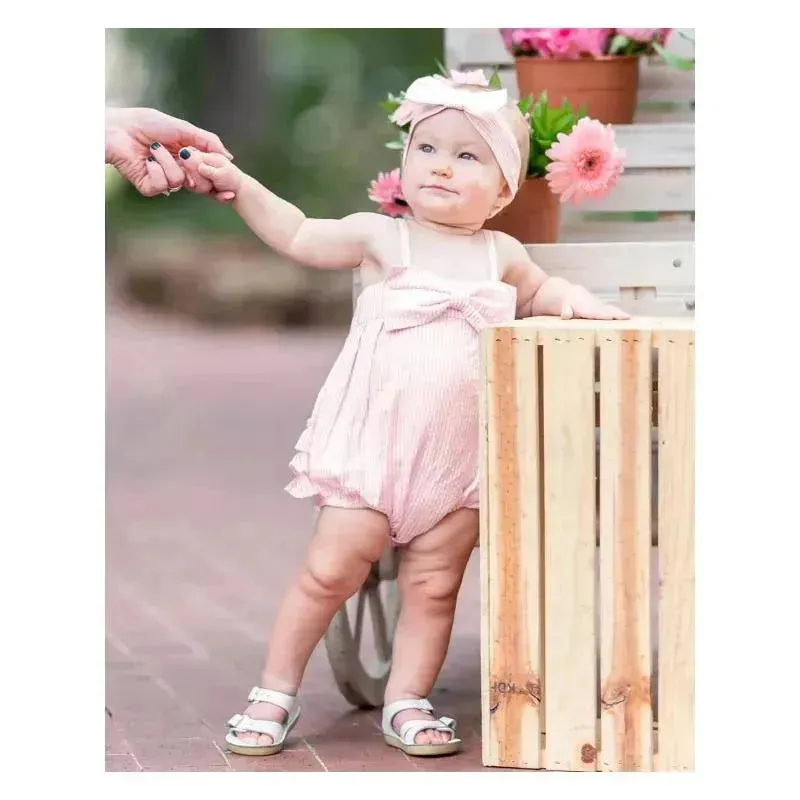 Rufflebutts - Baby Girls Pink Seersucker Bow Front Woven Bubble Romper